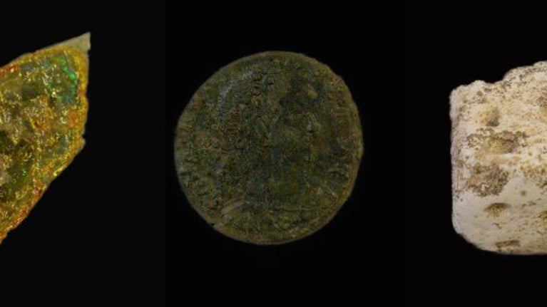 A piece of vessel glass, a copper alloy coin and a chalk gaming piece found during the Time Team archaeological dig at Branodunum in 2012.